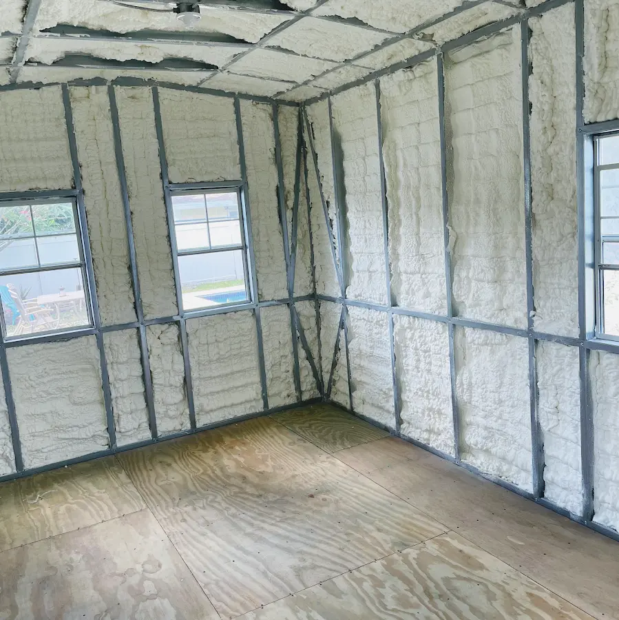 Closed-cell spray foam insulation applied to wall cavities in a residential project in Blythe